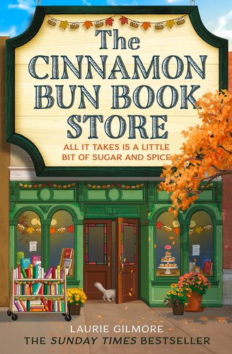 The Cinnamon Bun Book Store by Laurie Gilmore book cover featuring a store front with a cart of books, a cat, flowers, and colorful leaves.