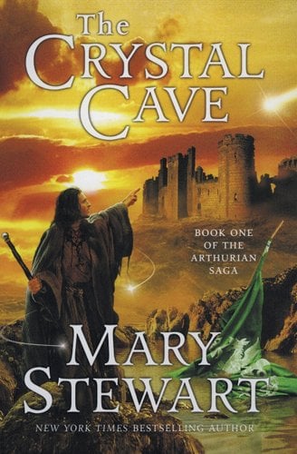 "The Crystal Cave" by Mary Stewart book cover of Merlin in a big cloak and a staff, pointing at a castle off in the distance, a green flag is in water.