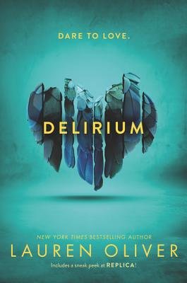 Delirium by Lauren Oliver, book cover. Dark teal background, a broken heart in multiple pieces is in the center, with the title on it.