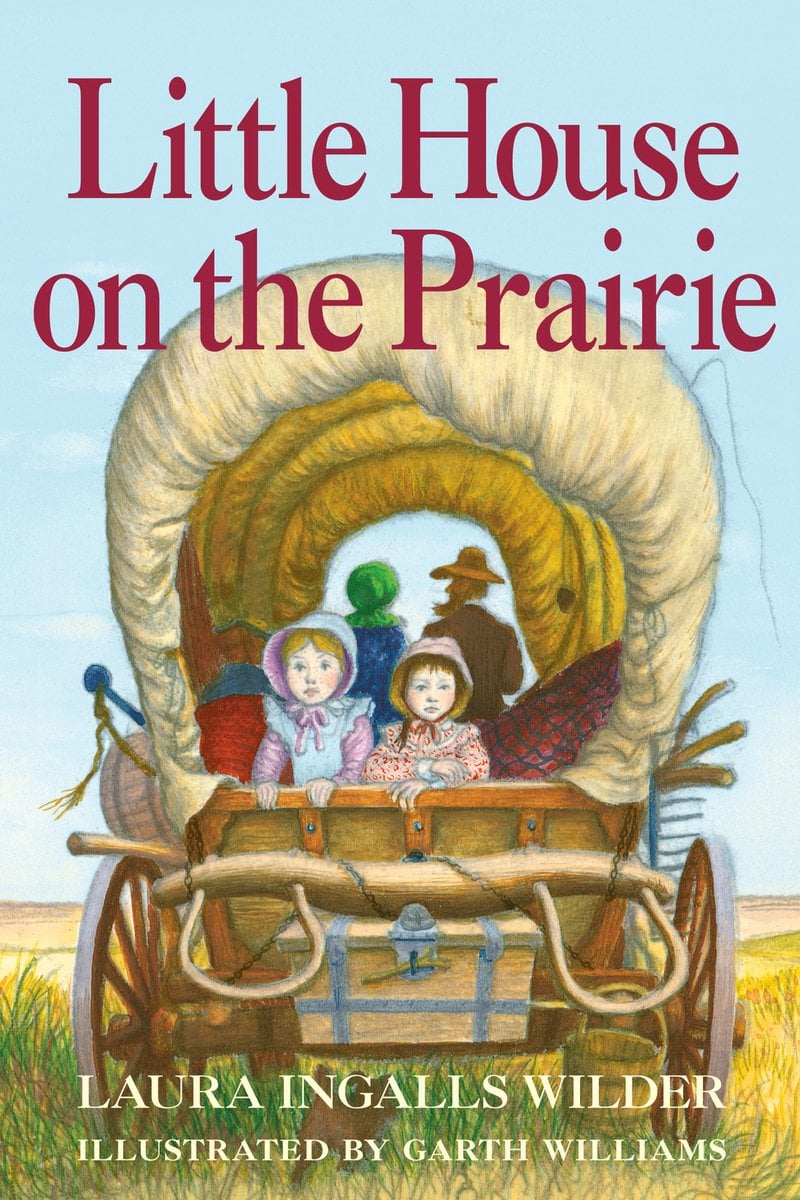 Book cover of Little House on the Prairie by Laura Ingalls Wilder, Illustrated by Garth Williams, featuring two light-skinned children wearing bonnets looking out from the back of a covered wagon; two adults are visible driving the wagon.