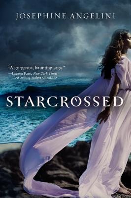 Starcrossed by Josephine Angelini, a fiction book cover depicting a storm-lit sea stretching beneath dark clouds. A young woman in a flowing lavender gown stands on rocky shore, her hair and dress caught in the wind as the bold white title is written at the centre and the author's name is at the top.