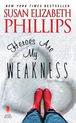 A book cover with a heart drawn in snow, a pair of feet standing in it. The person is wearing red boots, and it says "Heroes Are My Weakness" in the middle and "Susan Elizabeth Phillips" at the top.