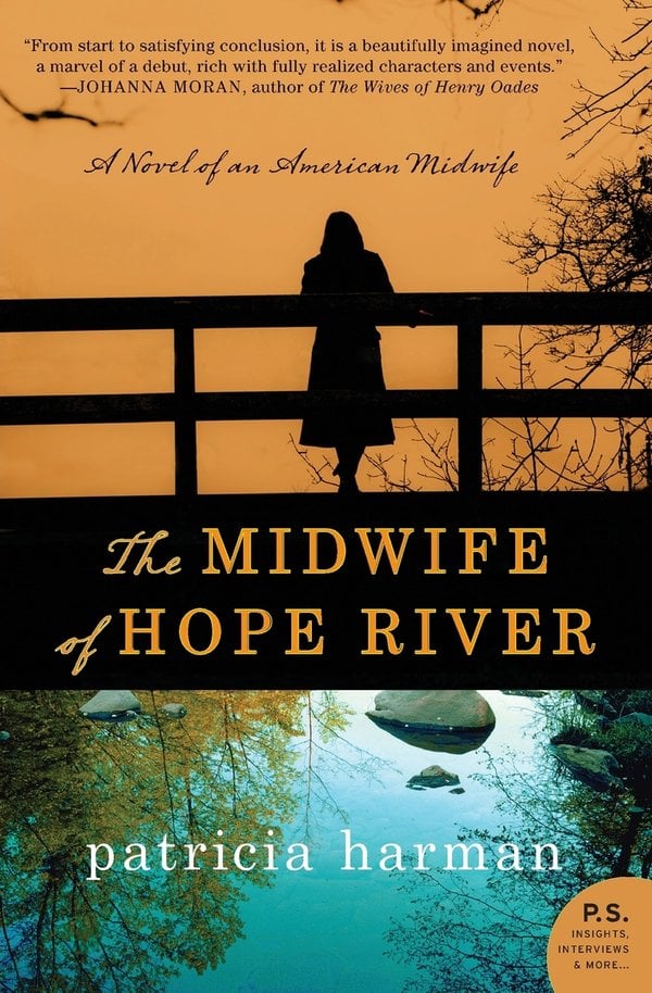 Book cover for The Midwife of Hope River by Patricia Harman, depicting a silhouette of a woman standing on a bridge overlooking a river below. The sky is opaque orange, and the river is blue with rocks and a reflection of trees.