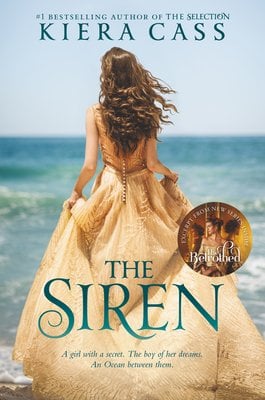 Cover of "The Siren" by Kiera Cass. A woman is walking out to see in a tan flowy dress.