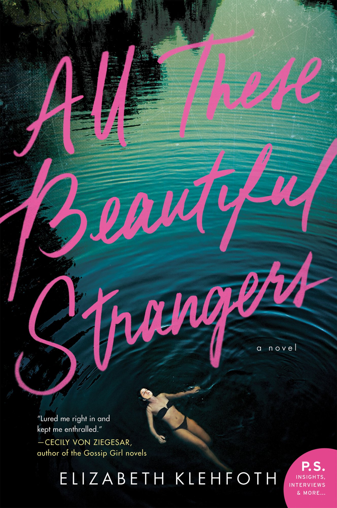 The book cover for All These Beautiful Strangers by Elizabeth Klehfoth. From above, a young girl in a black strapless bikini floats in a lake fading in a gradient from near black to various shades of blue and green. The title is over the top in pink cursive text.