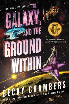 Book cover for The Galaxy, and the Ground Within by Becky Chambers featuring a black starry space background with two spaceships: a blue angular ship at the top and a purple ship at the bottom. The title appears in large white text split across three lines in the center. A gold circular badge indicates it's a Winner of the Hugo Award for Best Series. The author's name appears at the bottom with a note that it's a National Bestseller.