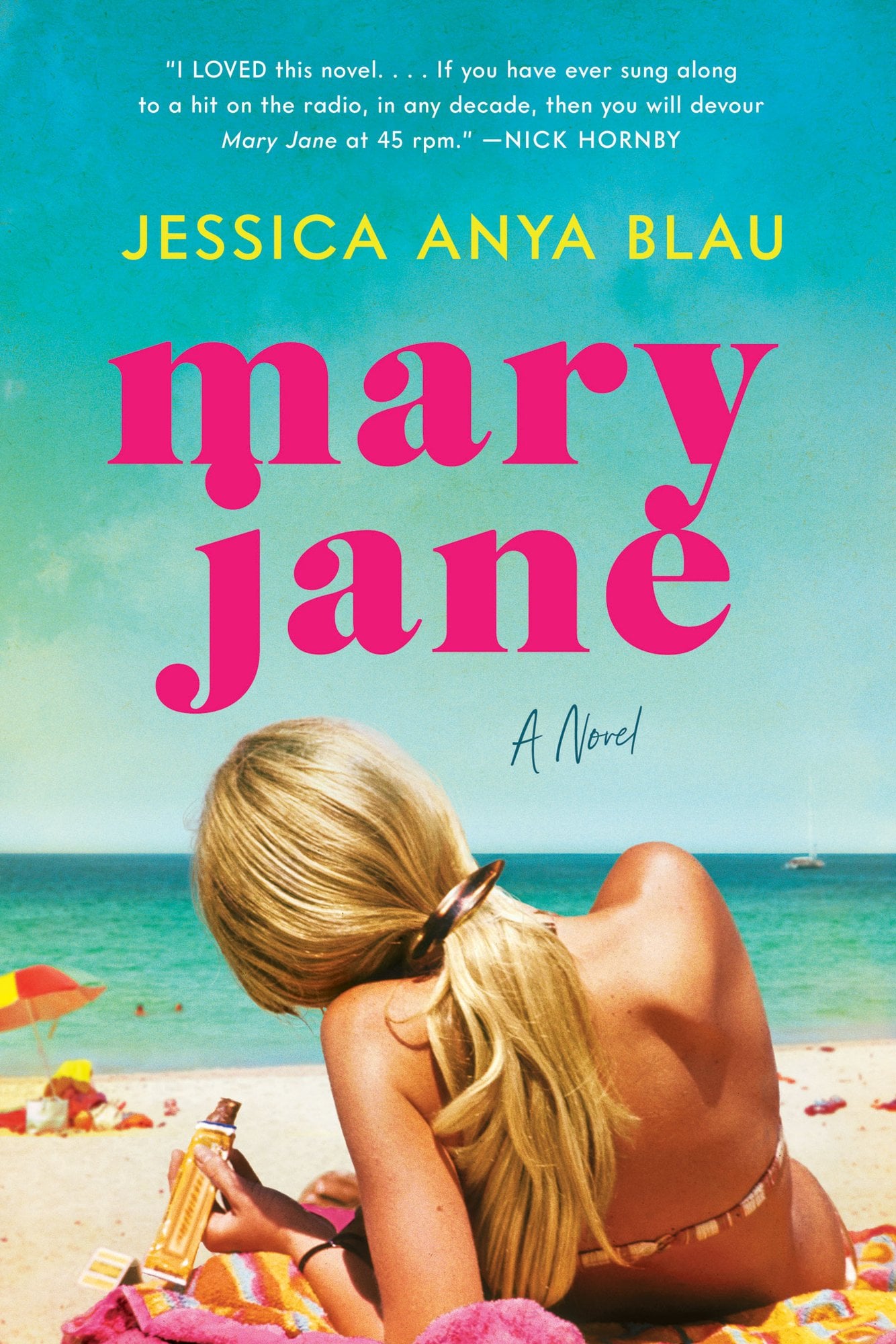 Mary Jane by Jessica Anya Blau, a historical fiction novel cover. The cover depicts a tanned, blonde haired girl sitting on the beach and looking away from the camera. Her hair is in a ponytail, held by a large rectangular clip and she is holding a chocolate bar in her left hand. In front of her is the ocean, and to her left is a small beach umbrella shielding a towel with shopping bags on top of it.