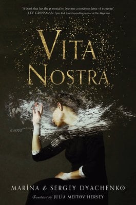 Book cover of 'Vita Nostra' by Maryna and Serhiy Dyachenko. The text is in stylized gold letters in the center. Just below, a woman is sitting and moving her head, with white and gold flakes dispersing all around her neck.