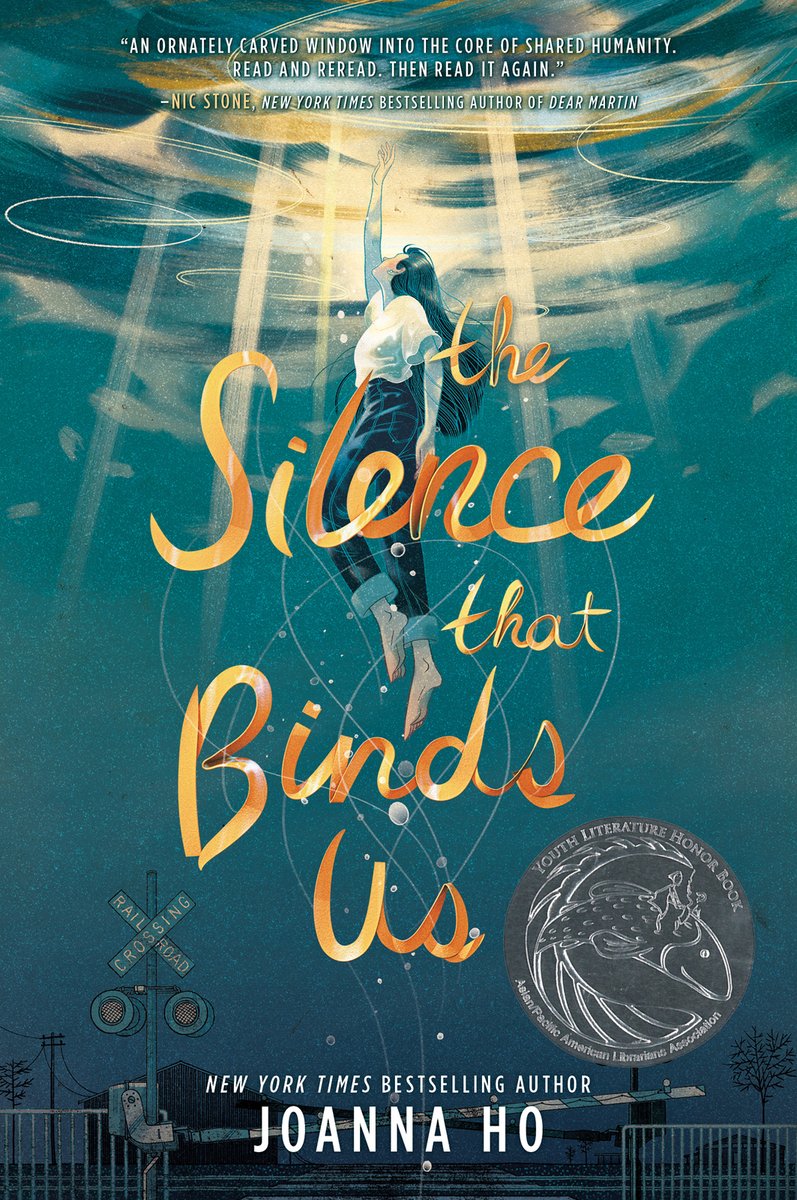 The book cover for The Silence that Binds Us. A drawing shows a woman in jeans and a white shirt swimming up to the surface of a body of water with the light shining at the top while a railroad crossing sits at the bottom of the water.