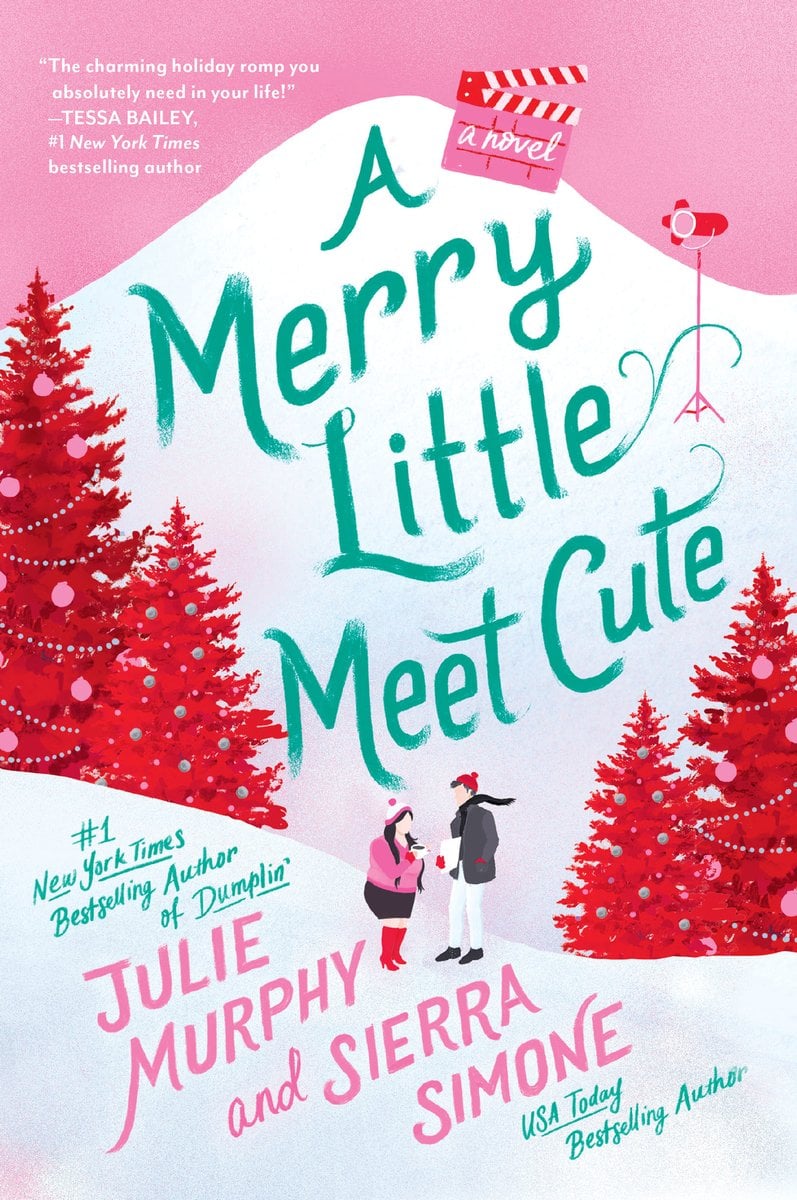 A Merry Little Meet Cute by Julie Murphy and Sierra Simone holiday romance book cover depicting a wintry wonderland with red Christmas trees decorated for the holidays. In the middle are two humans dressed in winter clothes. The title is in green on one of the snow-covered hills.