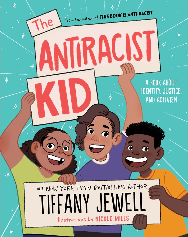 Book cover of The Antiracist Kid by Tiffany Jewell, Illustrated by Nicole Miles, featuring three smiling children of diverse skin tones and hair textures hold up cardboard signs that have the text of the title and creators' names.