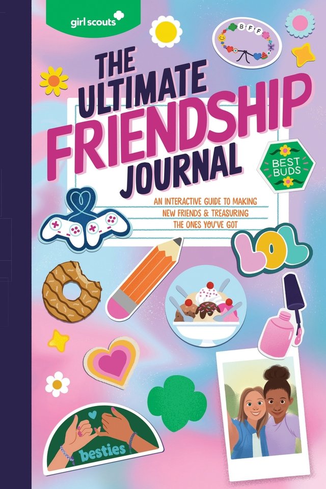 Girl Scouts: The Ultimate Friendship Journal by Girl Scouts shows a composition notebook style with stickers covering the front. The background is blue, pink, and purple, mixed in a swirl pattern and stickers include a polaroid of two girls, a Samoa cookie, besties pinky promise, a heart, flowers and stars, the Girl Scout symbol, video game remote controls, a pencil, ice cream, and a friendship bracelet.