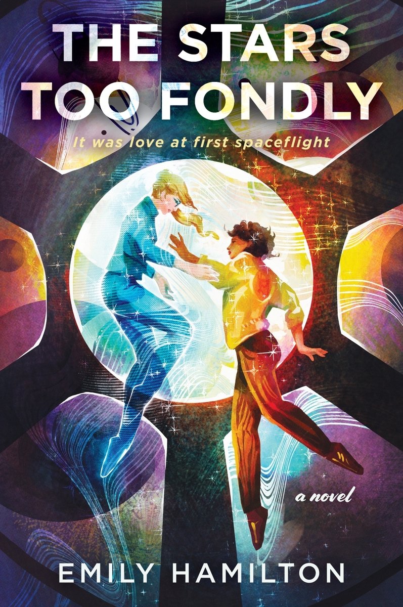 The Stars Too Fondly by Emily Hamilton, a sci-fi romance book cover depicting two women, one dressed in blue and another dressed in yellow, on a space-themed backdrop