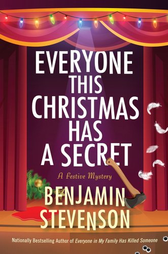 "Everyone This Christmas Has A Secret" by Benjamin Stevenson is a book cover of a stage with Christmas lights hanging on top, an ax stuck to the author's name, a fallen Christmas tree, and blood splattered on the floor.