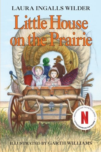 A Little House on the Prairie book cover with a covered wagon in a grassy plain. The sky is blue and there are people dressed as pilgrims inside the wagon.
