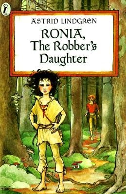 Girl with wild hair and her hands on her hips, standing in the middle of the woods, with a boy with a red shirt running up toward her