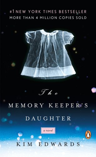 The Memory Keeper’s Daughter book cover of a black slowly turning to blue then white with a translucent baby shirt. White snow dabbles around the cover.