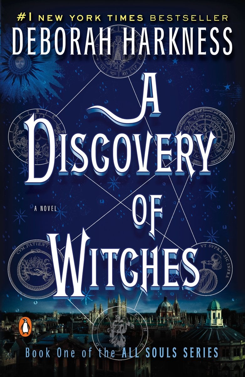 A Discovery of Witches by Deborah Harkness shows the night sky with a town below it. In the sky is six connected symbols.