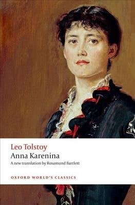 Anna Karenina by Leo Tolstoy, a fiction book cover. An oil painting of a pretty young woman with brown hair drawn back into a bun, a few pieces hanging on her forehead, wearing a blue, old-fashioned gown on a brownish gold background.