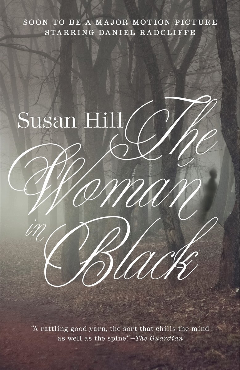 Cover of The Woman in Black by Susan Hill. Background is a misted forest with leaves on the ground and a ghostly figure in the back right.