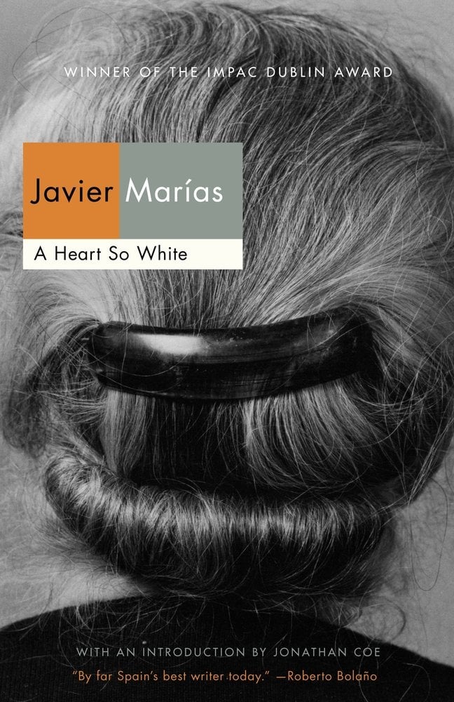 A Heart So White by Javier Marías. Black and white headshot of the back of a girl's head, and she is wearing a bun with a clip holding it together.