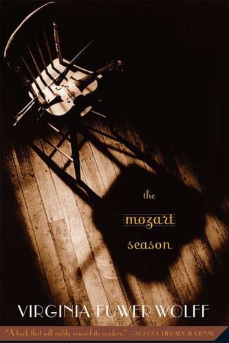 "The Mozart Season" by Virginia Euwer Wolff book cover of a chair in the shadows with a violin and string sitting on the chair as its shadow from the window casts heavy on the floor.