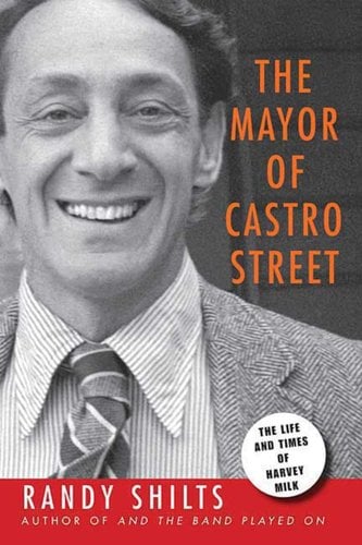 Book cover of The Mayor of Castro Street with Harvey Milk smiling and staring forward in a suit and in black and white.