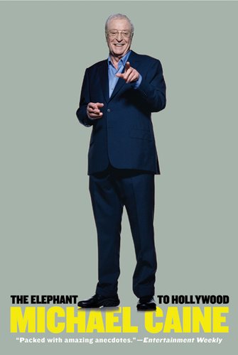 Book cover of "The Elephant to Hollywood," with Michael Caine standing, smiling, and pointing on a muted green cover.