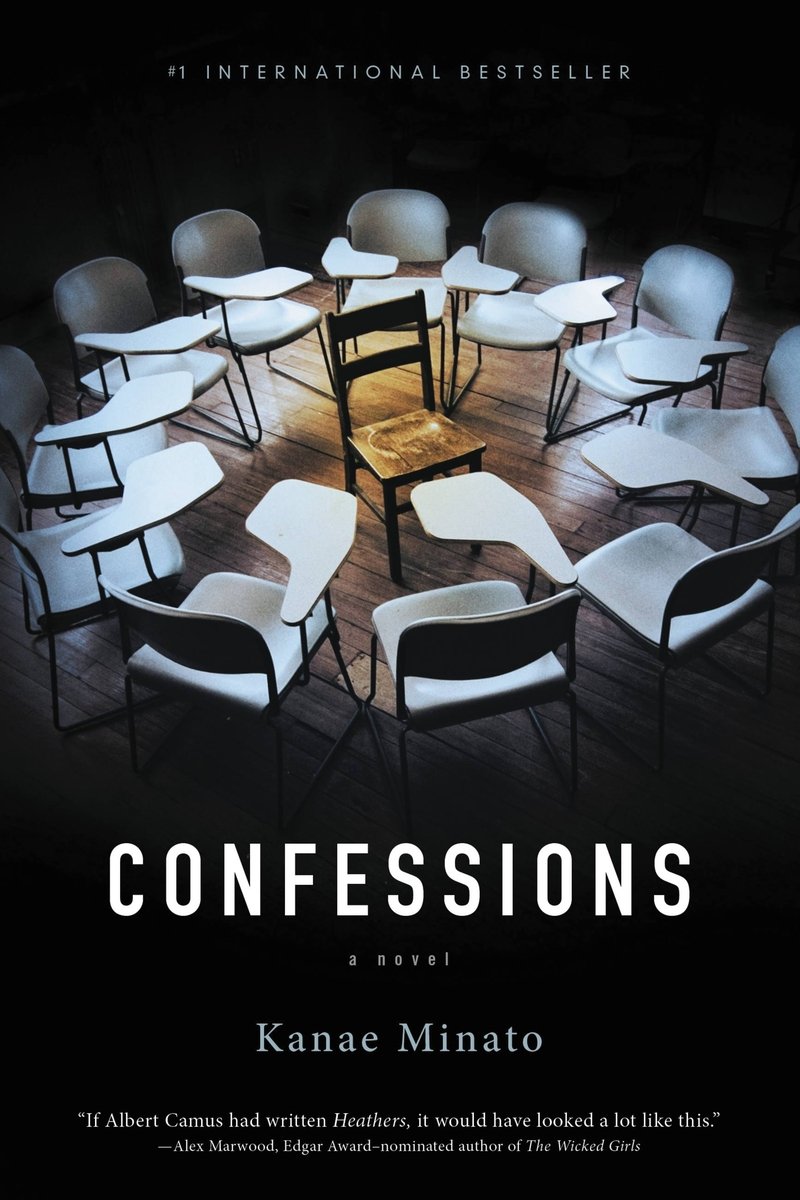 The book cover for 'Confessions' by Kanae Minato. In the top center, shrouded in darkness, is a photo of all-white desk-chairs like those of a classroom in a circle, surrounding a wooden chair at the center.