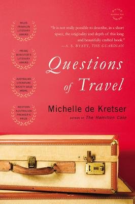 Questions of Travel by Michelle de Kretser, book cover. It is all red in the background with a leather suitcase.