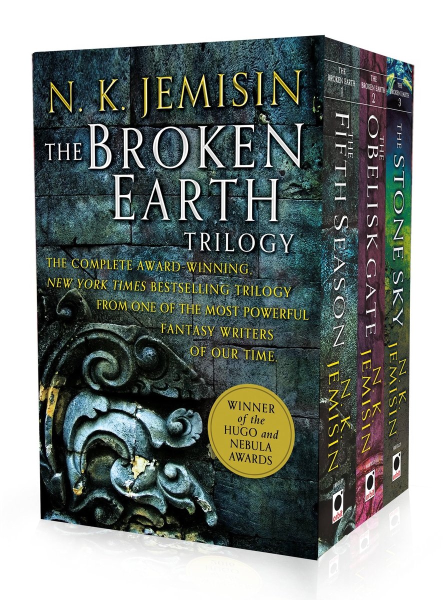 A book set of N.K. Jemisin's The Broken Earth trilogy. It shows an etched symbol from her series.