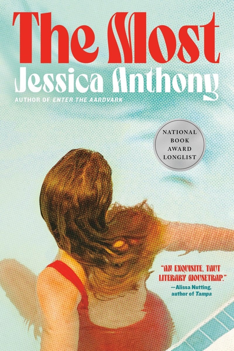 The book cover for The Most by Jessica Anthony. From behind, a woman with pale skin and long golden brown hair wears a red swim suit and sits in the edge of a blue swimming pool. The title is above in red text.