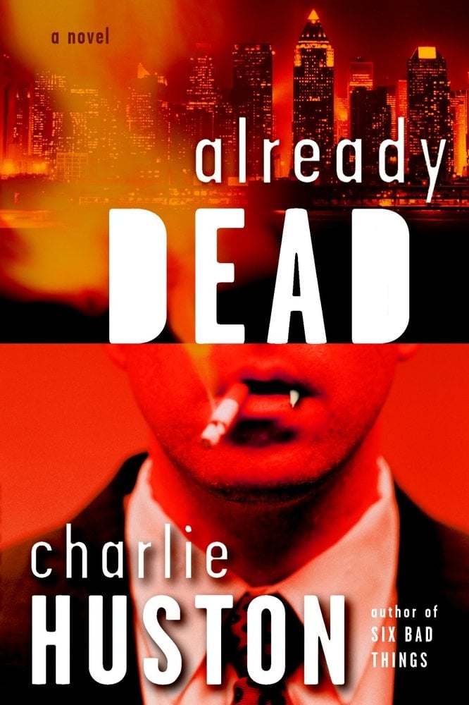 Already Dead by Charlie Huston, author of Six Bad Things, a novel with a book cover featuring bold white typography against a fiery orange city skyline and a close-up of an open mouth with vampire fangs in vivid red tones.
