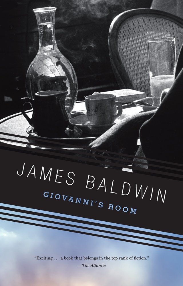 Giovanni's Room by James Baldwin, book cover. A dark depiction of a table with drinks and char in the background.