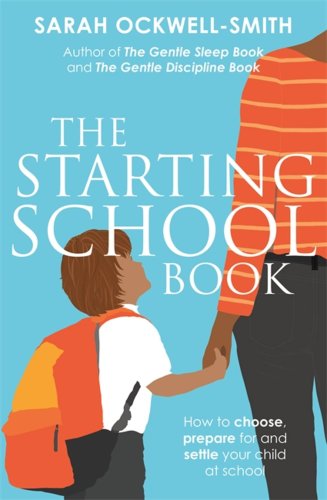 A young boy is wearing an orange backpack holding his parent's hand while looking up at them. In front of a blue background.