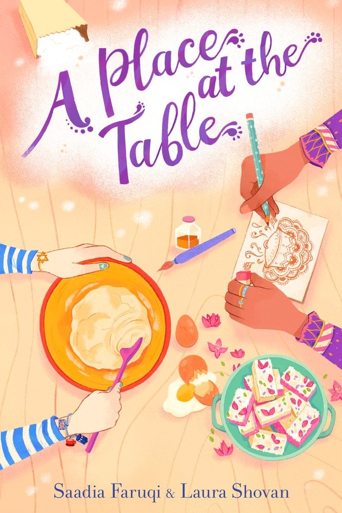 A Place at the Table by Saadia Farqui book cover features two pairs of hands - one mixing in a bowl and the other drawing on a piece of paper - at a table. A bowl of sweet treats and a cracked egg lay amongst them.