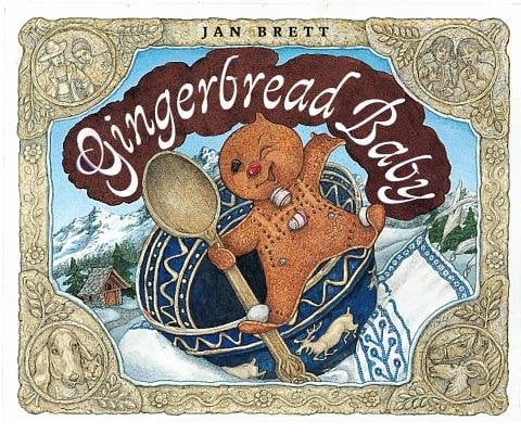 The Gingerbread Baby by Jan Brett book cover features center stage the mischievous gingerbread baby, freshly leapt from the oven, clutching a wooden spoon and perched atop a richly patterned blue bowl — his cheerful expression and playful stance capture the lively spirit of the chase that follows. He’s framed by an ornate gold‑border that features whimsical vignettes of forest animals and Swiss alpine motifs, recalling the book’s snow‑covered village setting. Behind him, the sky is a crisp winter blue, and snow‑tipped pines and quaint chalets peek out, reinforcing a sense of folk‑tale charm. The title “Gingerbread Baby” curves across the top in a warm, creamy white script, its arcs echoing the gingerbread‑roll swirl of the border and the roundness of the bowl.