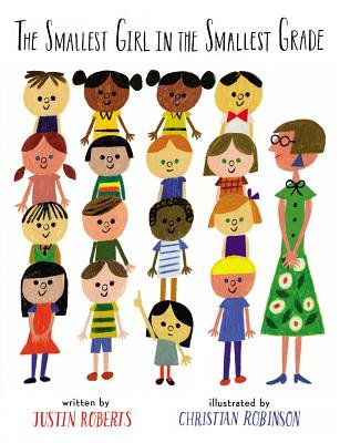 The Smallest Girl in the Smallest Grade by Justin Roberts book cover is set on a solid, white background featuring a class of sixteen students lined up in even rows of four. The teacher stands in a green daisy dress with short, blonde hair and glasses to the right. The title is in a handwritten, all caps like font at the top. The author's and illustrator's name is in red and blue font at the bottom of the cover.