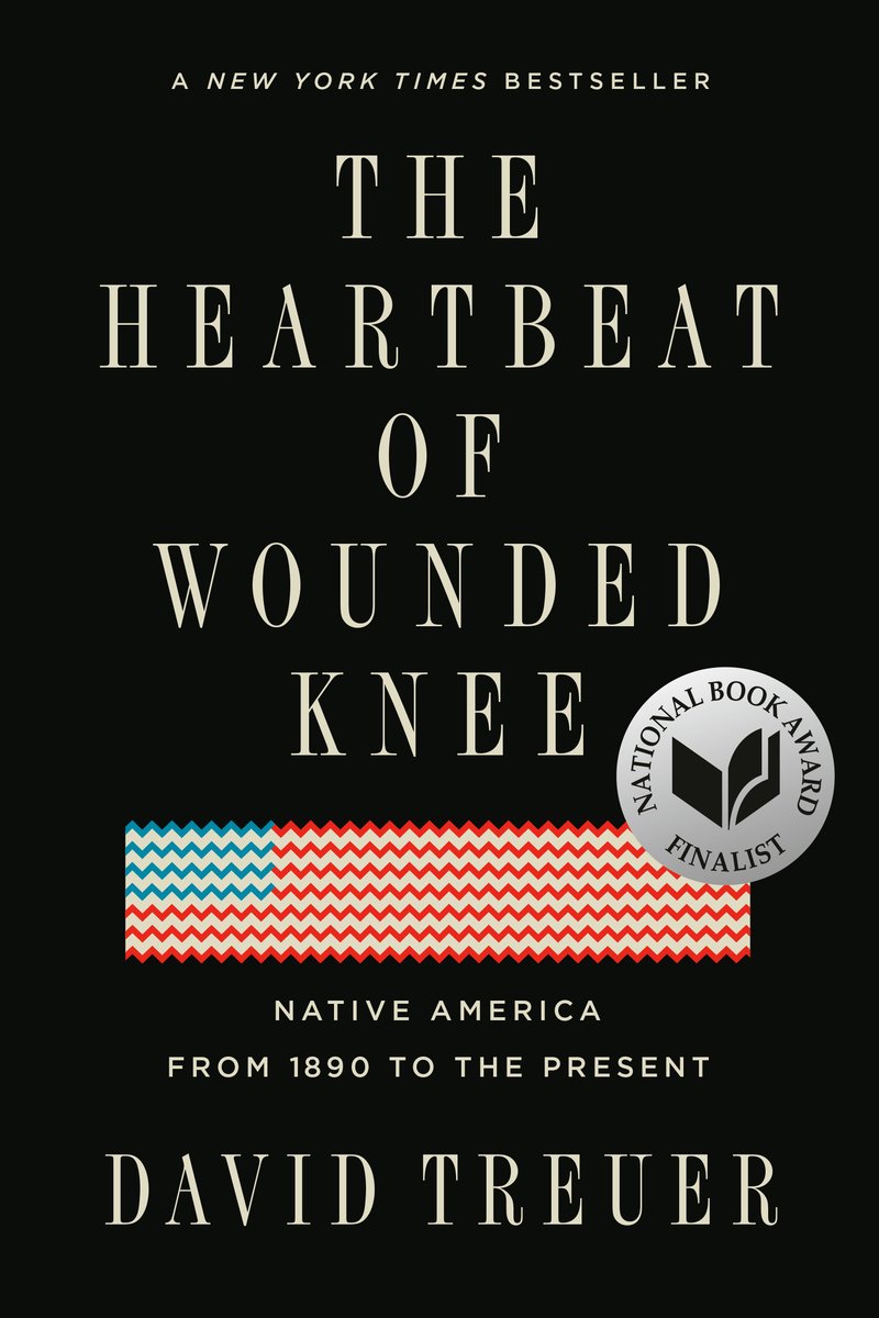 The Heartbeat of Wounded Knee by David Treuer, black book cover with title capitalised in white and an image of the American flag in a woven style.