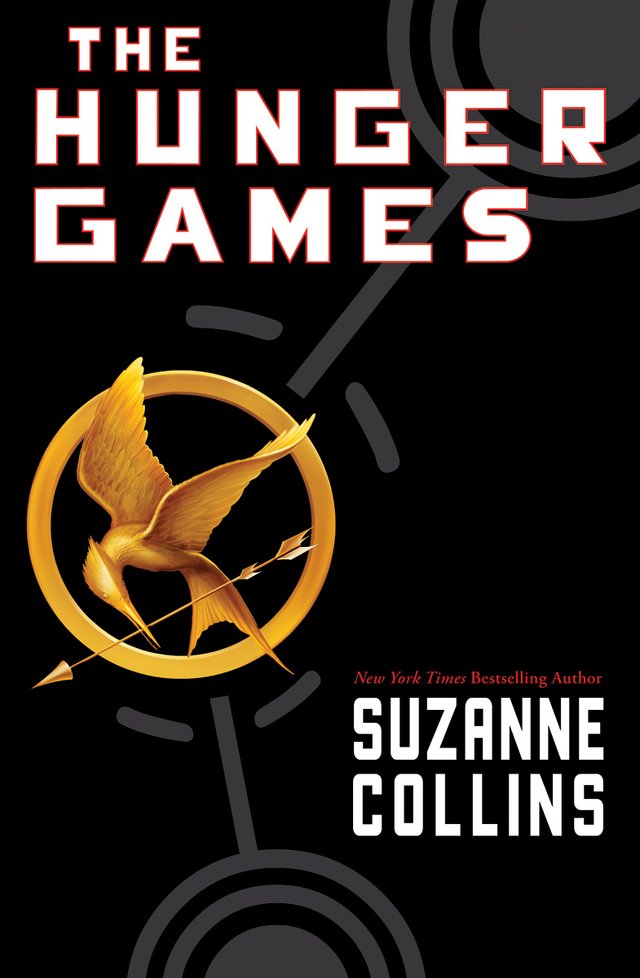 A golden mockingjay - bird with an arrow engraved in a circle - centres in the cover. The title 'The Hunger Games' and author's name surround.