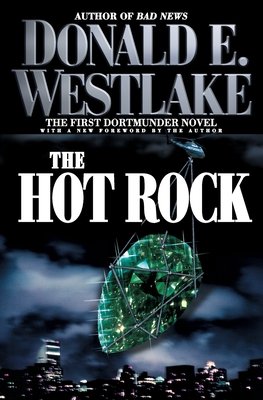 The Hot Rock by Donald E. Westlake book cover depicting a greenish gem sparkling in the night sky as it is being carried away by helicopter.