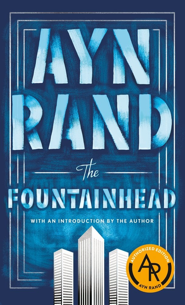 Cover of "The Fountainhead" by Ayn Rand. Three tall buildings stand at the bottom of the cover, and an all-blue background.