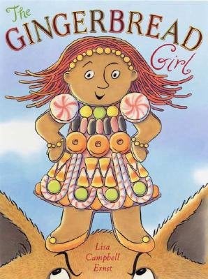 The Gingerbread Girl by Lisa Campbell Ernst book cover features the gingerbread girl herself—bold, confident, and colorful—with candy buttons, peppermint‑swirl details and licorice‑whip hair framing her smiling face. She strikes a strong pose (hands on hips, ready to run) against a backdrop of soft sky blue, which gives the image a bright, inviting feel. Around the edges, a subtle gingham‑check border in muted tones adds a touch of cozy, homespun warmth. Above the figure, the title “THE GINGERBREAD GIRL” appears in a warm, deep red serif font that complements the candy tones in her dress and hair, while the author/illustrator’s name appears in smaller type at the bottom.