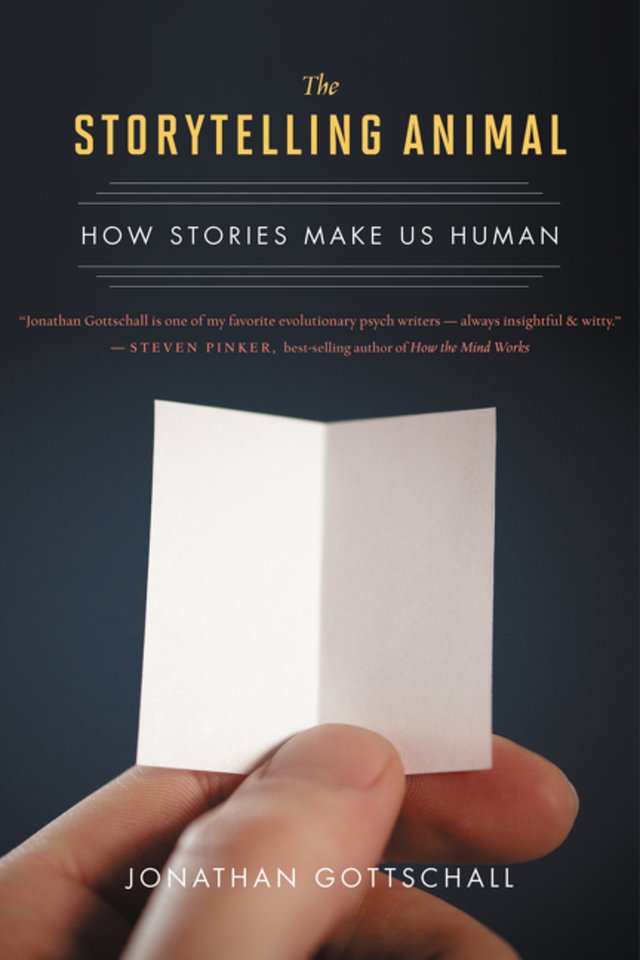 The Storytelling Animals: How Stories Make Us Human by Jonathan Gottschall. Has a blank piece of paper held open with a hand before a plain grey background.