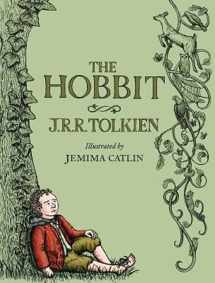 The Hobbit, a classic children's tale by J.R.R. Tolkien illustrated edition book cover of a sage green background and a tall tree with vines of ivy growing up its side and a deer, spider web, bird, and owl hanging on the vines. Main character Bilbo Baggins is sitting on the floor and leaning on the tree with his feet sprawled out.