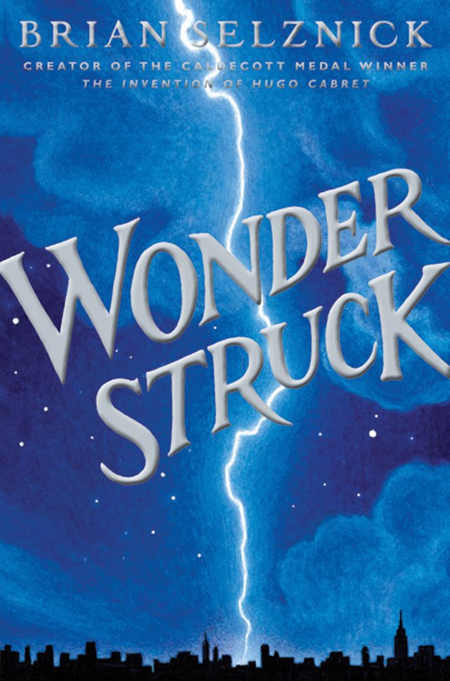 The cover of Wonderstruck, a middle grade historical fiction novel, features a large streak of lighting down the center the page and the silhouette of a city at the bottom