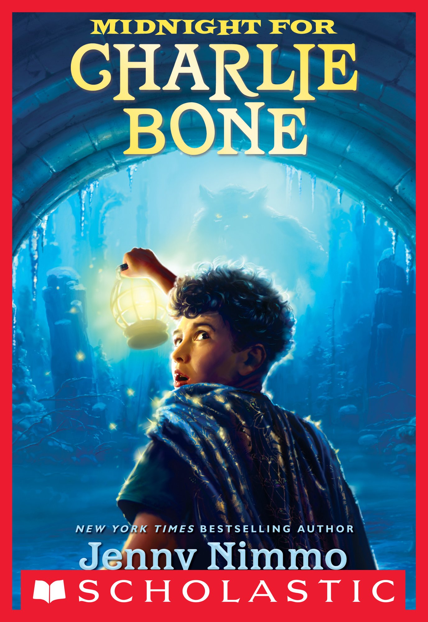 Midnight for Charlie Bone by Jenny Nimmo middle-grade book cover depicting a young boy looking back toward the camera with a lantern in his hand. He is headed into a tunnel with rocks on either side. In the foggy distance, eyes from a monster glow.