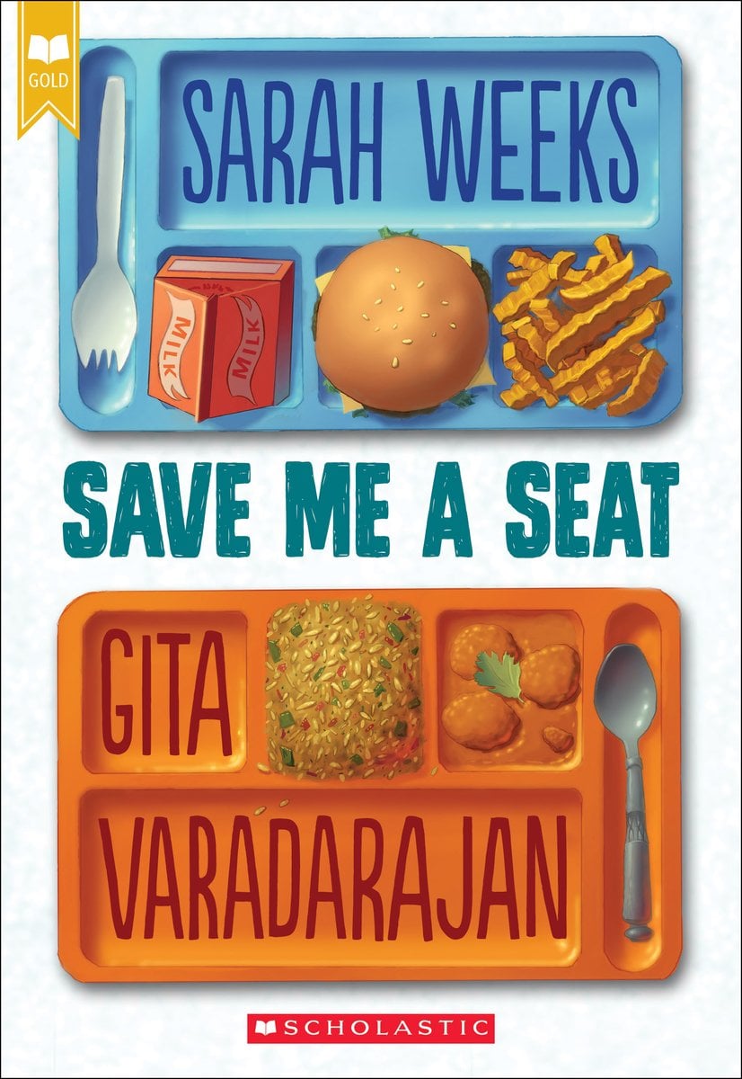 Save Me a Seat by Sarah Weeks. the cover is a blue lunch tray at the top half, and an orange lunch tray on the bottom half. And each tray has different food on it.