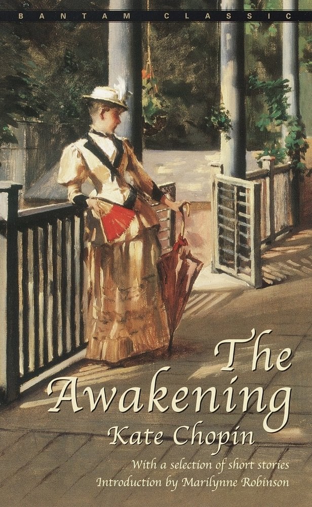 The Awakening by Kate Chopin's cover depicts the painting of a woman leading against a fence with a fan and an umbrella.