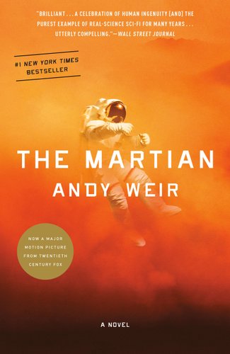 The background features a bright orange at the top blending into darker shades and then black towards the bottom with an astronaut floating in the centre. "The Martian" and "Andy Weit" are written across the middle of the page in white.